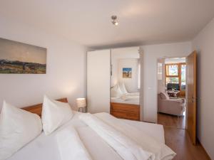 Postel nebo postele na pokoji v ubytování Apartment Chesa Piz Cotschen 3 by Interhome