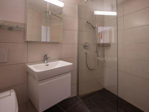 Koupelna v ubytování Apartment Chesa Piz Cotschen 3 by Interhome