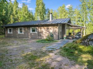 a small house with a roof at Holiday Home Villa blombacka by Interhome in Isnäs