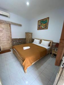 Postel nebo postele na pokoji v ubytování Krisna Homestay