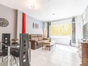 A seating area at Apartment Puigmal by Interhome