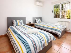 Posteľ alebo postele v izbe v ubytovaní Villa Bellvue by Interhome