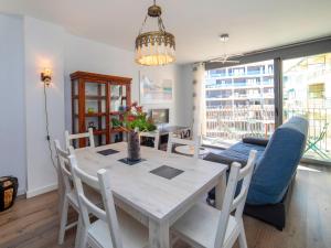 a dining room with a table and chairs and a couch at Apartment Isea Calpe-5 by Interhome in Calpe