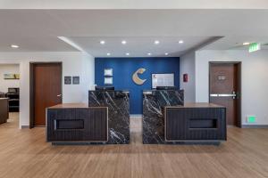 an office with two reception desks in a lobby at Comfort Inn & Suites Bennett in Bennett