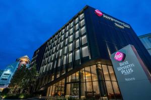 a building with a best western plus sign in front of it at Best Western Plus Nexen Pattaya in Pattaya