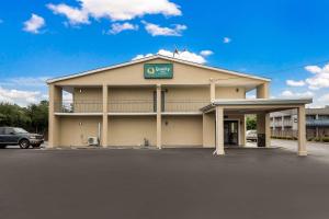 a building with a sign on the front of it at Quality Inn in Gastonia