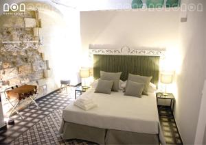 Un pat sau paturi într-o cameră la Sangiuliano