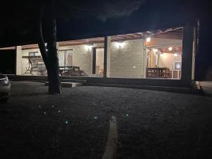 a house at night with a tree in the yard at Stavros Country House in Siá