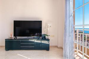 Et tv og/eller underholdning på Arco Iris Duplex Ocean View PH09