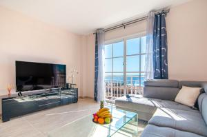 Et tv og/eller underholdning på Arco Iris Duplex Ocean View PH09