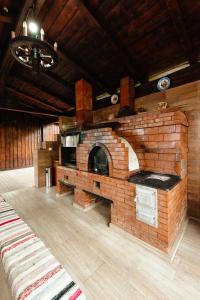 a brick oven in the middle of a room at Pensiunea Agroturistica Rares in Cluj-Napoca