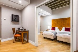 Säng eller sängar i ett rum på Hotel Delle Nazioni