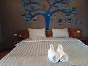 Postel nebo postele na pokoji v ubytování Nangnon Hill Hug Hotel