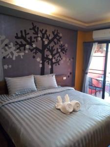 Postel nebo postele na pokoji v ubytování Nangnon Hill Hug Hotel