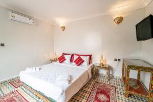 Postel nebo postele na pokoji v ubytování Riad Taj Salma