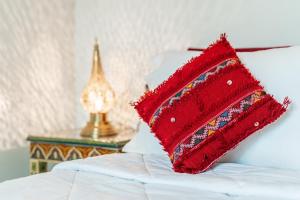 Postel nebo postele na pokoji v ubytování Riad Taj Salma