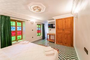 Postel nebo postele na pokoji v ubytování Riad Taj Salma