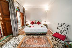 Postel nebo postele na pokoji v ubytování Riad Taj Salma