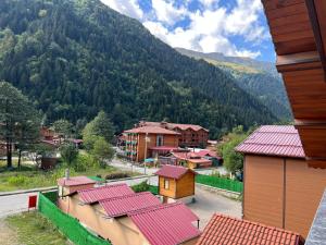 a view of a small town with a mountain at Karadeniz Apart Otel in Uzungol