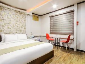 Postel nebo postele na pokoji v ubytování Opera Motel