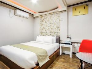 Postel nebo postele na pokoji v ubytování Opera Motel