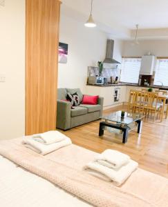 a living room with a couch and a table at Battersea apartment in London