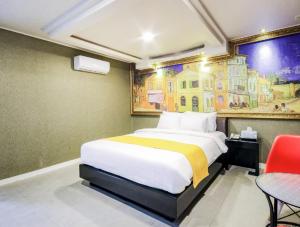 Postel nebo postele na pokoji v ubytování Opera Motel
