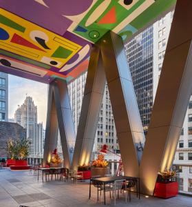 a view of a building with tables and chairs at citizenM Chicago Downtown in Chicago