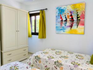Posteľ alebo postele v izbe v ubytovaní Beach Bungalow Holiday Home