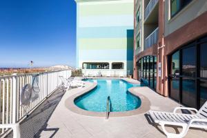 a swimming pool on the balcony of a building at Harbor Place 313 in Gulf Shores