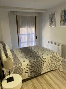 Postel nebo postele na pokoji v ubytování Casa Alberto 1 izda