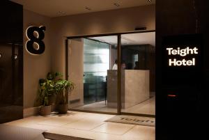 a hotel lobby with a sign that reads fight hotel at Teight Hotel in Thessaloniki