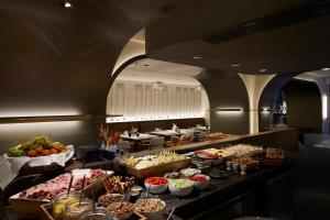 a buffet line with many different types of food at Teight Hotel in Thessaloniki