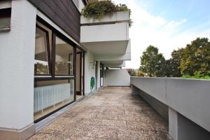 a walkway leading to the side of a building at LaMiaCasa Design Apartment near Ludwigsburg 2,5 rooms 75 sqm in Schwieberdingen