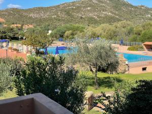 a view of a resort with a swimming pool at Sardegna Beach Cala Reale in Santa Marinella
