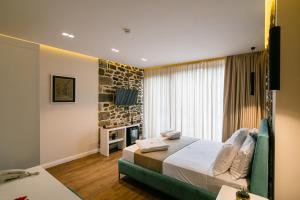 Postel nebo postele na pokoji v ubytování Vecchia Boutique Hotel