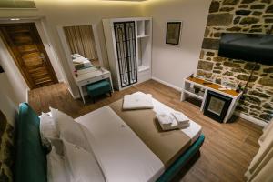 Postel nebo postele na pokoji v ubytování Vecchia Boutique Hotel