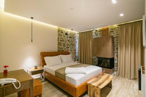 Postel nebo postele na pokoji v ubytování Vecchia Boutique Hotel