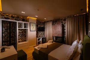 Postel nebo postele na pokoji v ubytování Vecchia Boutique Hotel
