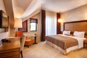 Postel nebo postele na pokoji v ubytování Hotel MIR
