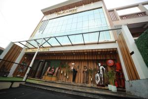 a store front of a store with a mannequin in the window at THE HOTEL PARADISE in Gorakhpur