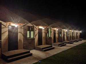 a row of lights on a building at night at 7ROOMS boutique hotel in Yeghegnadzor