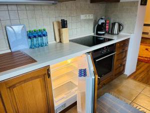 Kuchyň nebo kuchyňský kout v ubytování Apartmán Olívia 8 Hrabovská dolina