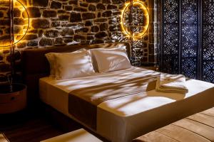 Postel nebo postele na pokoji v ubytování Vecchia Boutique Hotel
