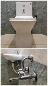 a white toilet in a bathroom with a sink at La Township Residency in Puducherry