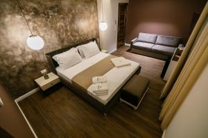 Postel nebo postele na pokoji v ubytování Vecchia Boutique Hotel