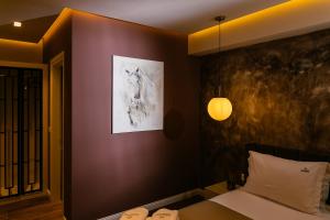 Postel nebo postele na pokoji v ubytování Vecchia Boutique Hotel