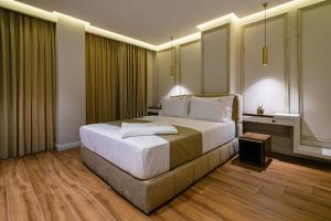 Postel nebo postele na pokoji v ubytování Vecchia Boutique Hotel