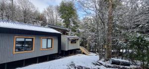 a tiny house on a train in the snow at Refugio PIREN, Corralco, Hot Tub y nieve in Curacautín