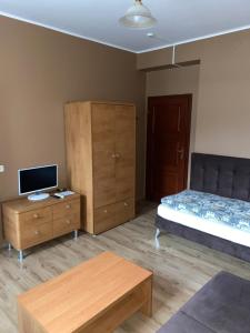 Łóżko lub łóżka w pokoju w obiekcie Zajazd Kadar